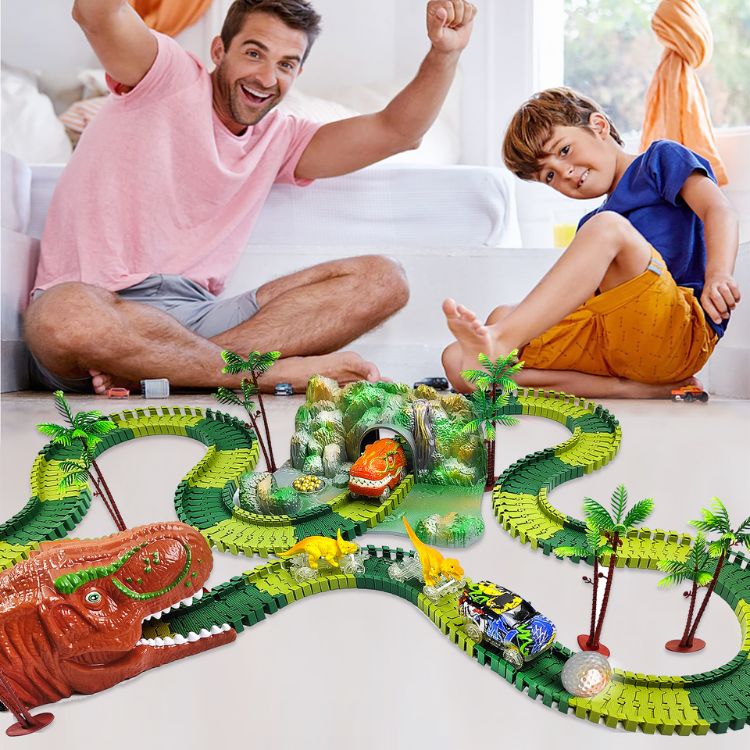 jeune garçon et son papa qui joue au circuit voiture dinosaure jouet jouets dinosaures jouet dinosaures voiture dinosaures circuit voiture dinosaures